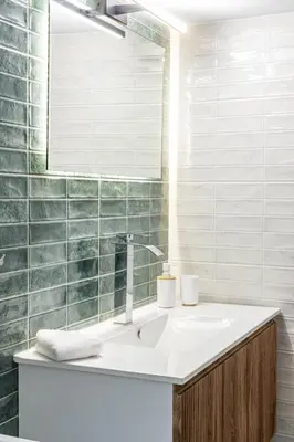 a bathroom with a sink and a mirror at Acropolis Canvas-3BDR in Athens