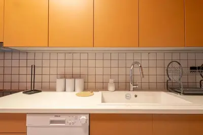 a kitchen with a sink and a counter top at Acropolis Canvas-3BDR in Athens