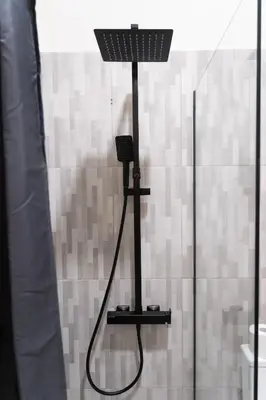 a lamp in a shower in a bathroom at Monza in Athens
