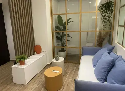a living room with a couch and a table at Athens at Your Doorstep Chic Syntagma Apartment in Athens