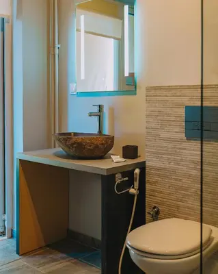a bathroom with a sink and a toilet at Modern 2BR Apt Glyfada Center and Private Veranda in Athens