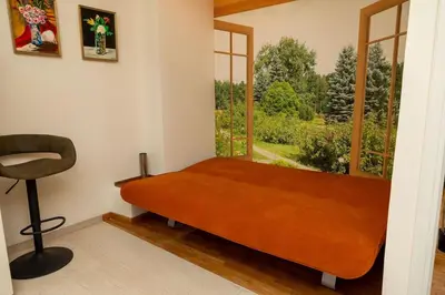 a bed in a room with a window and a chair at Krisila Boutique Stay in Athens