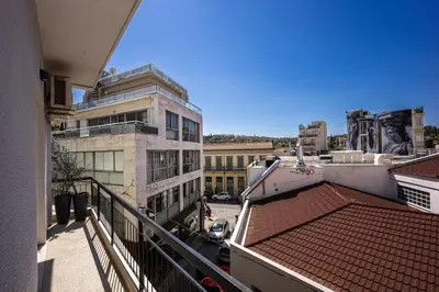 a view of a city from a balcony of a building at Athens Nala in Athens