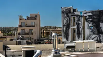 a mural on the side of a building at Athens Nala in Athens