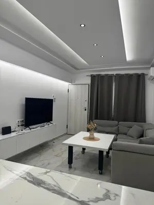a living room with a couch and a table at Cozy, Quiet & Modern Apartment in Athens