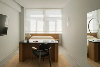 a bedroom with a desk with a chair and a bed at P28 Suite 103 in Athens