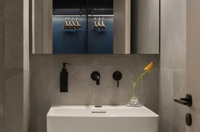 a bathroom with a white sink and a mirror at P28 Suite 103 in Athens