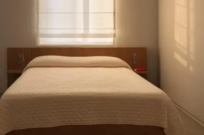 a bed in a bedroom with a window at P28 Suite 103 in Athens