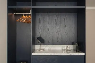 a black kitchen with a counter with a mirror at P28 Suite 103 in Athens