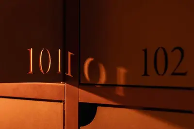 a close up of a metal object with the number at P28 Suite 109 in Athens