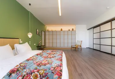 a bedroom with a large bed with a colorful blanket at Athens Heart Urban Zen Loft in Athens