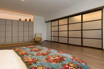 a large room with a large bed on the floor at Athens Heart Urban Zen Loft in Athens