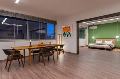 a dining room with a table and a bed at Athens Heart Urban Zen Loft in Athens