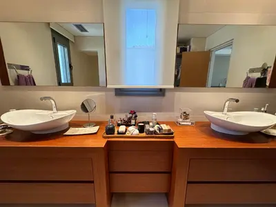 a bathroom with two sinks and two mirrors at BonVilla Seaview Oasis in Anavissos