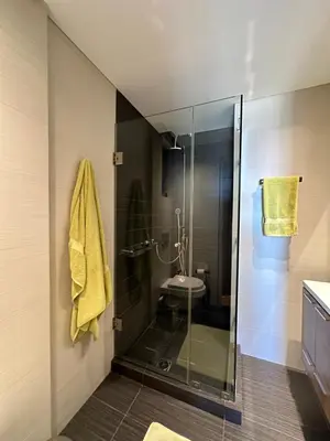 a bathroom with a glass shower with a toilet at BonVilla Seaview Oasis in Anavissos