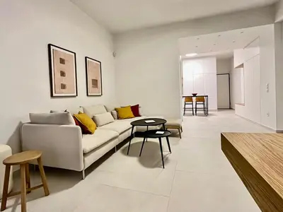 a living room with a couch and a table at New 1BR Apt modern and light in Athens