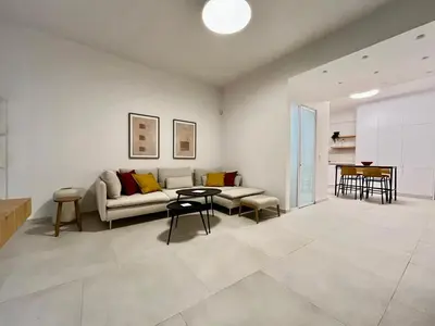 a living room with a couch and a table at New 1BR Apt modern and light in Athens