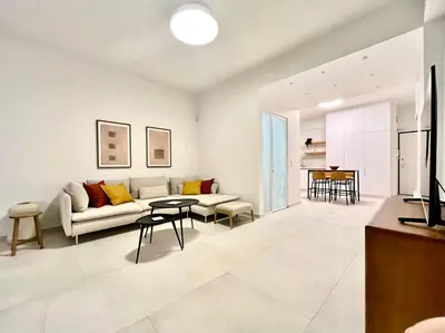 a living room with a couch and a table at New 1BR Apt modern and light in Athens