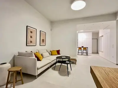 a living room with a couch and a table at New 1BR Apt modern and light in Athens
