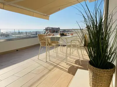 a balcony with a table and chairs and a view at Top-Floor 2BR Penthouse with Stunning Sea View in Athens