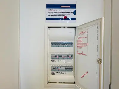 a refrigerator with a sign on the wall at Top-Floor 2BR Penthouse with Stunning Sea View in Athens