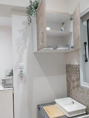a kitchen with a sink and a counter top at Jungle Lodge Athens at metro in Athens