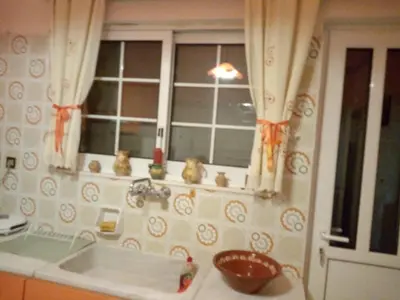 a kitchen with a sink and a window at ΕΥΧΑΡΙΣΤΗ Διαμονη in Athens