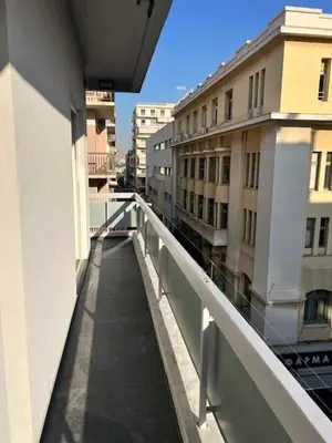 a view of a walkway from a balcony of a building at Charming Flat with Traditional & Elegant Style in Piraeus