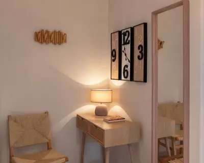 a room with a table with a lamp and a mirror at Pro2Acropolis in Athens