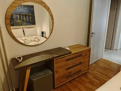 a bathroom with a mirror and a wooden dresser at Pro2Acropolis in Athens