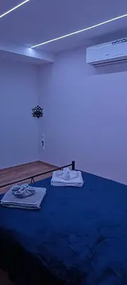 a room with two mattresses on a blue bed at CityZen Apartment in Athens