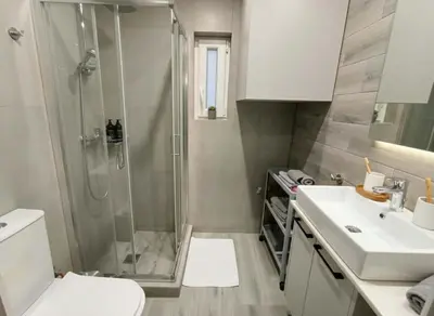 a bathroom with a shower and a toilet and a sink at Your Little Athenian Retreat Ampelokipoi Studio in Athens