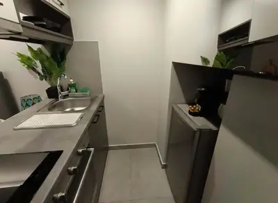 a small kitchen with a sink and a dishwasher at Your Little Athenian Retreat Ampelokipoi Studio in Athens