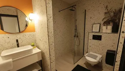 a bathroom with a shower and a sink and a toilet at The Victoria Suite Chic & Modern Studio Stay in Athens