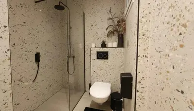 a bathroom with a shower and a toilet in it at The Victoria Suite Chic & Modern Studio Stay in Athens