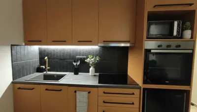 a kitchen with a sink and a microwave at The Victoria Suite Chic & Modern Studio Stay in Athens