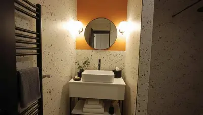a bathroom with a sink and a mirror on the wall at The Victoria Suite Chic & Modern Studio Stay in Athens