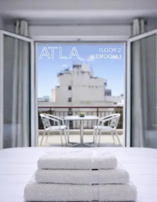 a pile of towels sitting on top of a table at Atla Living Athens in Athens