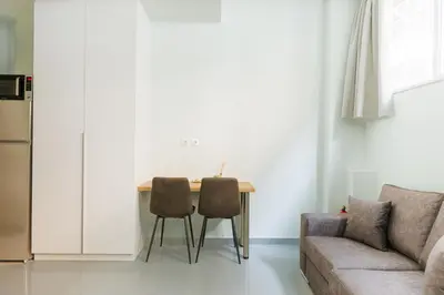 a living room with a table and a couch at Charming 1BR Studio in the Heart of Athens in Athens