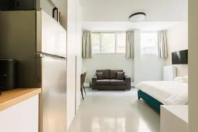 a bedroom with a bed and a couch at Charming 1BR Studio in the Heart of Athens in Athens