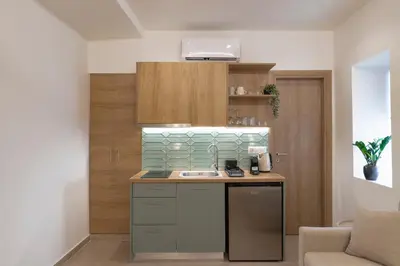 a kitchen with a sink and a counter at AthenianNest Asomaton Boutique Studio in Psyrri near Acropolis in Athens