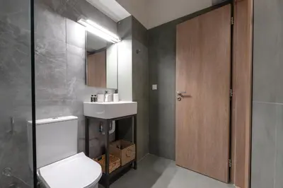 a bathroom with a toilet and a sink and a mirror at AthenianNest Asomaton Boutique Studio in Psyrri near Acropolis in Athens