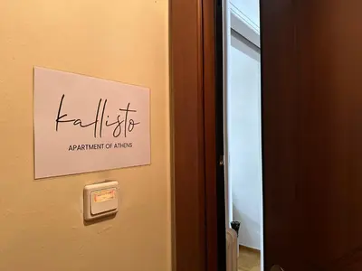a sign on the door of a room at Kallisto Heart of Athens in Athens