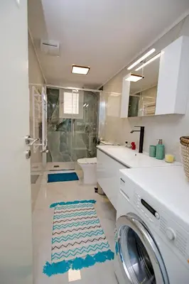 a bathroom with a washer and dryer at Retro Athens in Athens