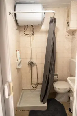 a bathroom with a shower and a toilet at 15 minutes from Athens airport in Porto Rafti