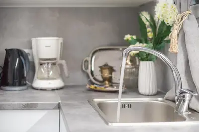 a kitchen counter with a sink and a blender at Elegant Dimitra, Your Beautiful Home in Athens, by Acropolin in Athens