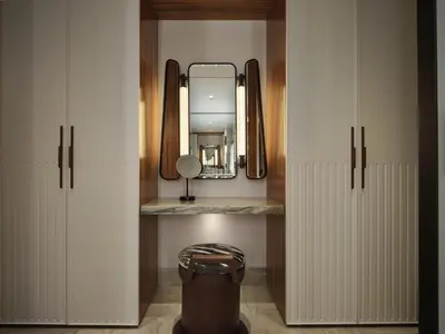 a room with a mirror and a trash can in a locker at Conrad Athens The Ilisian in Athens