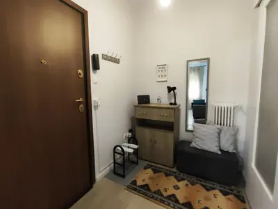 a room with a door and a dresser and a mirror at RG Living Spaces Neo Psychiko in Athens