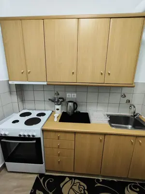 a kitchen with a stove and a sink at RG Living Spaces Neo Psychiko in Athens