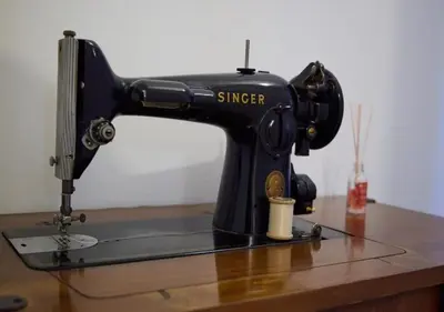 a black sewing machine sitting on top of a table at Kefallinias Classic in Athens